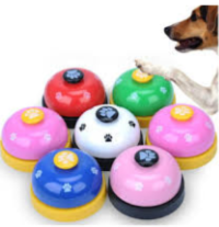 six various dog training bells. Two pinks, one white, one red, one blue, and one green.